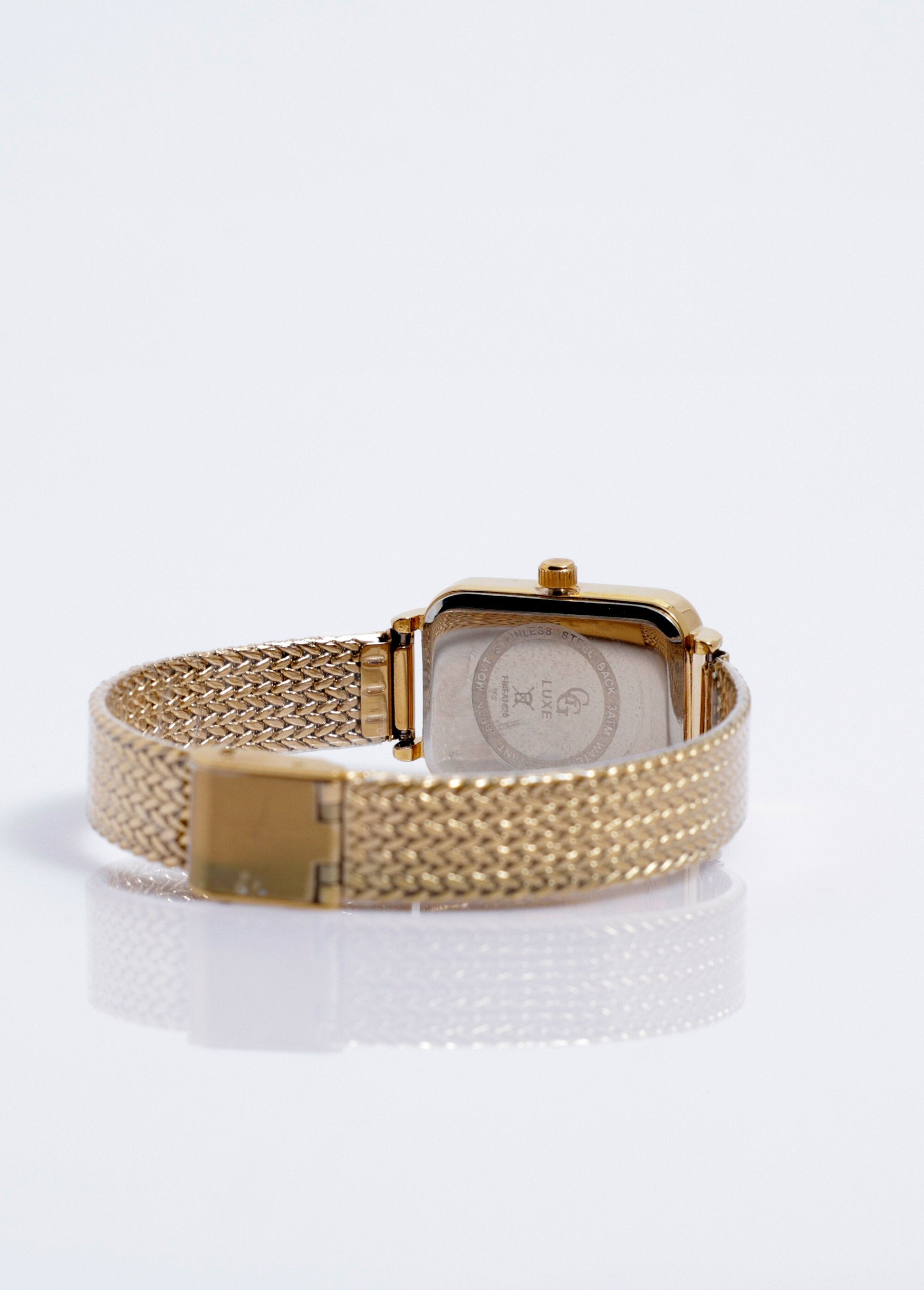 Jewelry_watch_with_a_rectangular_dial_and_rhinestones_Gold_green_DO1_slim